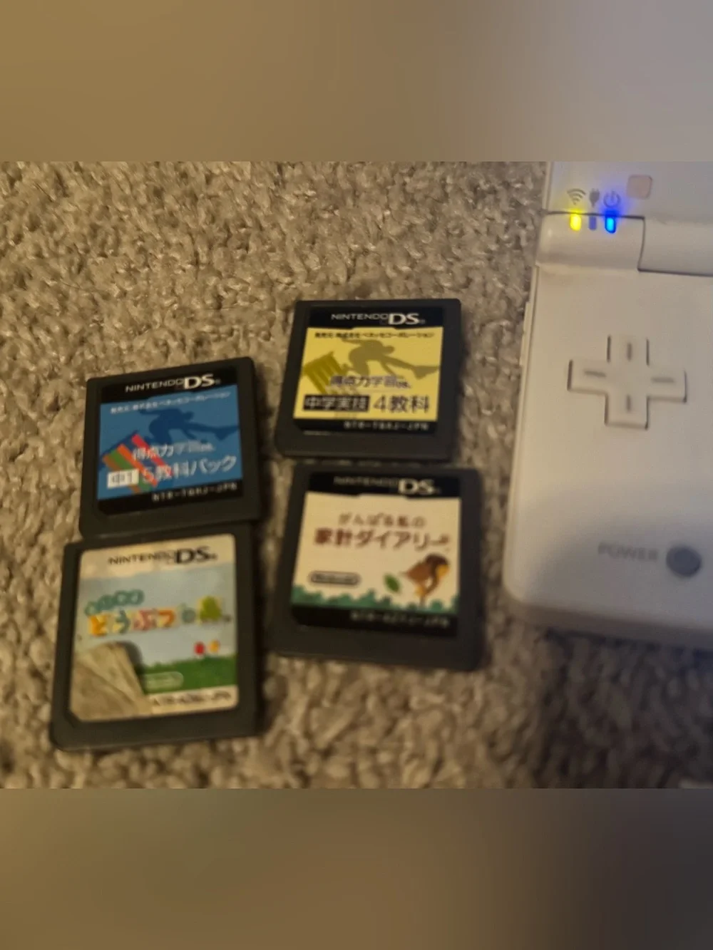 Nintendo DSI White Dual-Screen Handheld with 4 DS Game Cartridges - Japanese